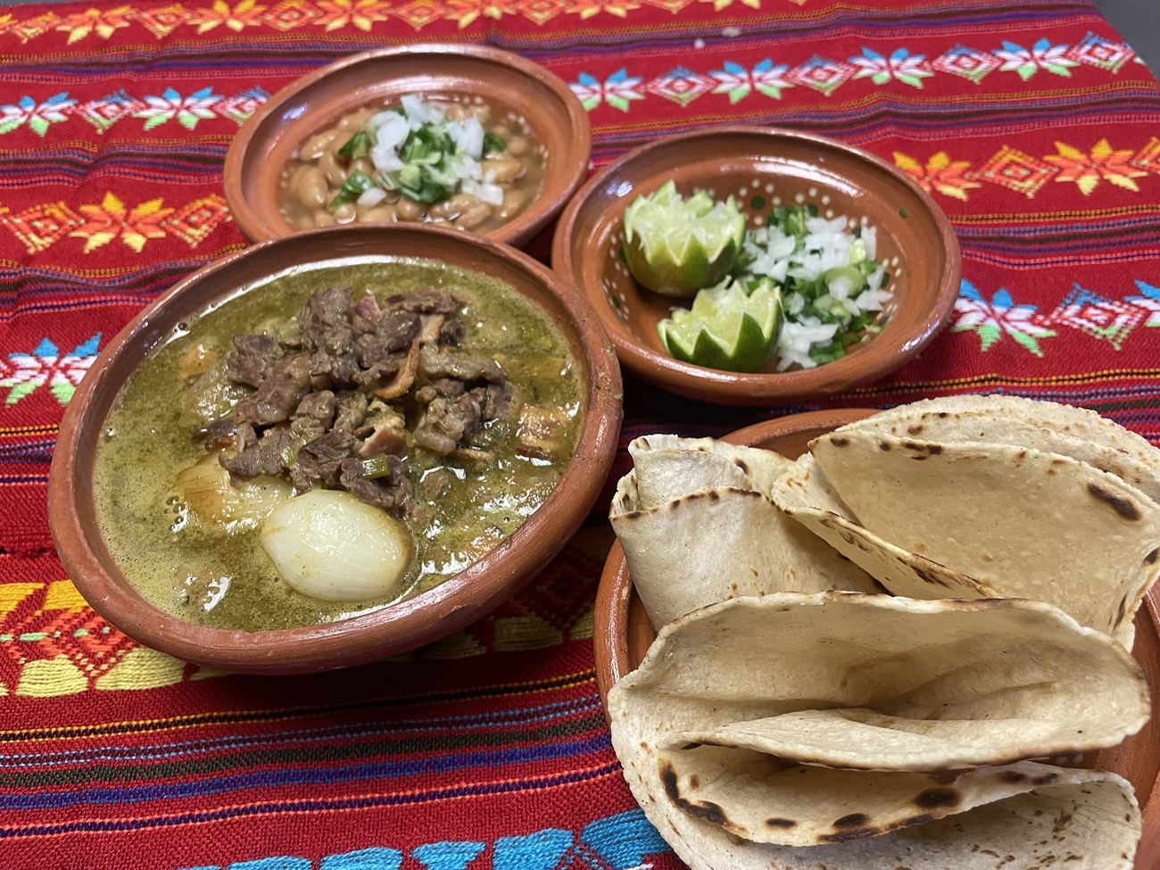 Carne en su jugo with beans, limes and handmade tortillas