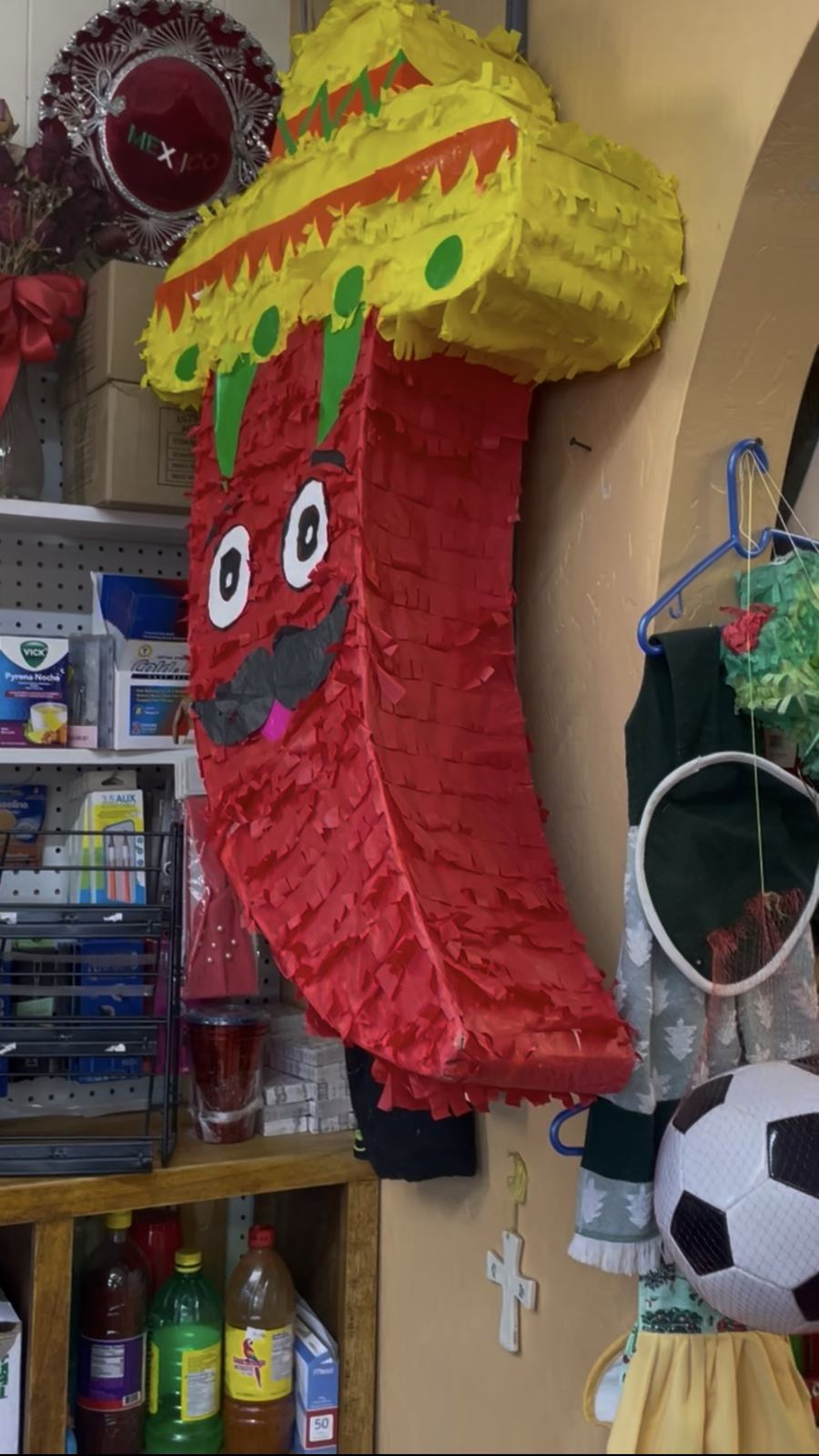 Handmade chile piñata with a sombrero and mustache